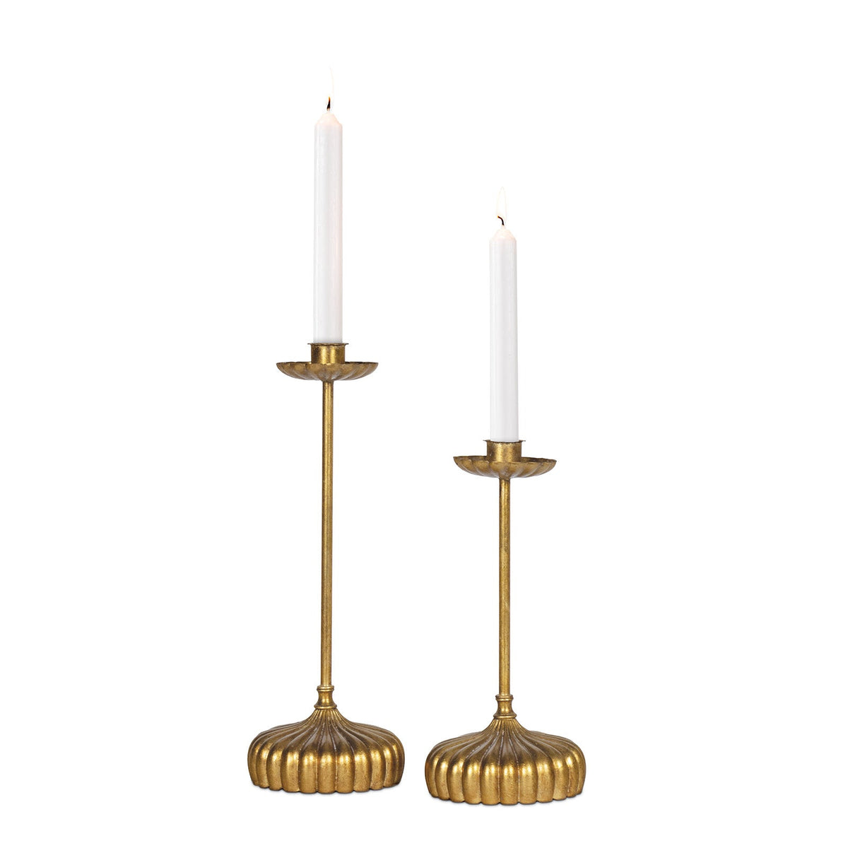 Set of two antique gold Clove candle holders with bobeche detailing and white taper candles.
