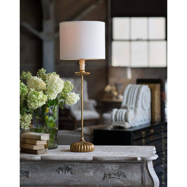 Clove Stem Buffet Table Lamp with an antiqued gold base and natural linen shade.
