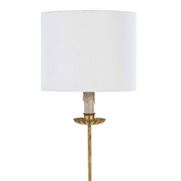 Elegant Clove Stem Buffet Table Lamp with an antiqued gold base and a natural linen shade.