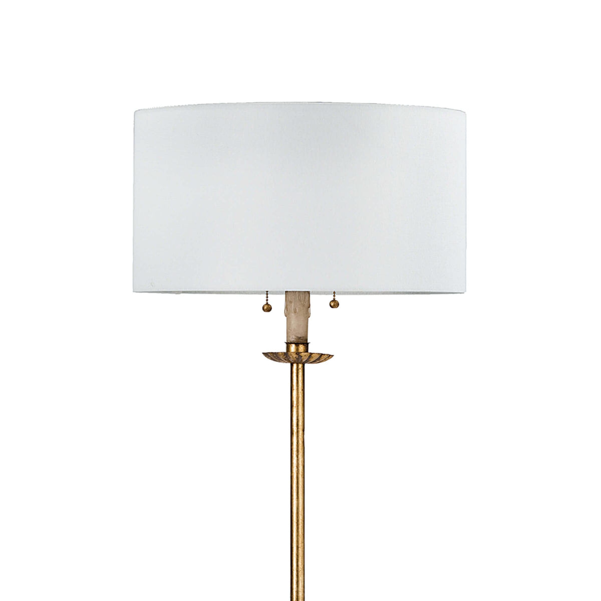 Clove Stem Floor Lamp with antiqued gold leaf finish and a natural linen shade.