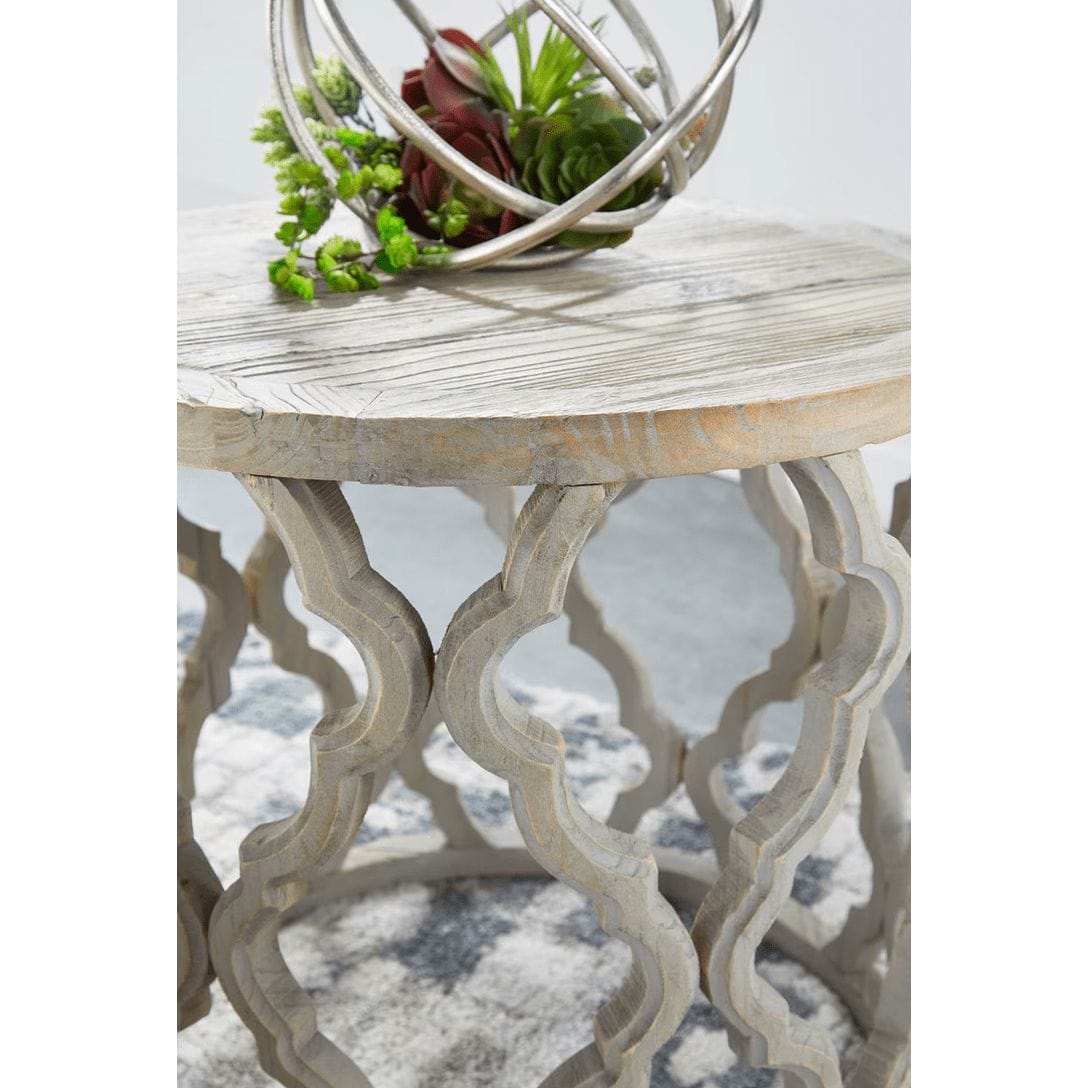 Clover reclaimed elm end table with a smoke gray finish, unique plank top, and quatrefoil-inspired carved base.