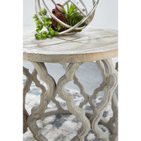 Clover reclaimed elm end table with a smoke gray finish, unique plank top, and quatrefoil-inspired carved base.