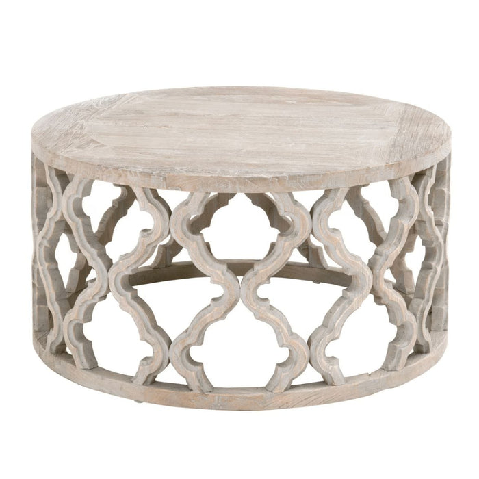 Round Clover reclaimed elm end table with smoke gray finish and quatrefoil carved base.