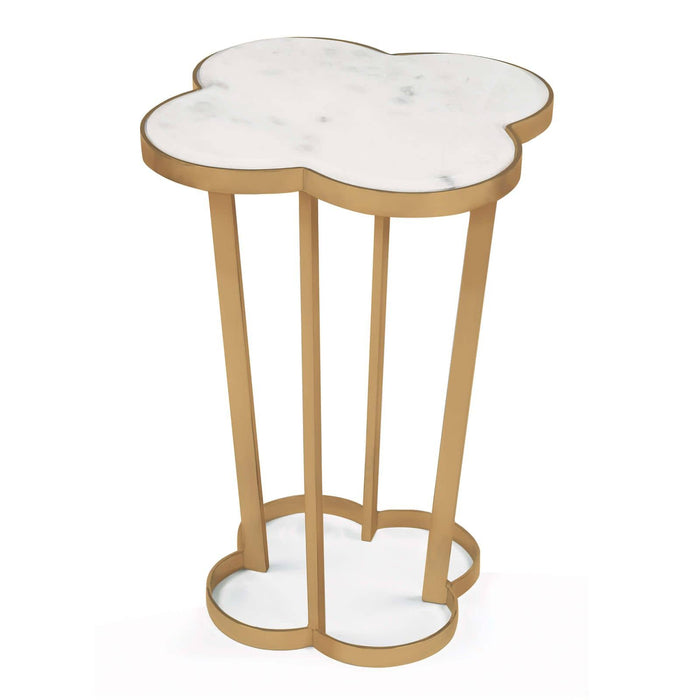 Clover-shaped side table with creamy white marble top and natural brass steel frame.