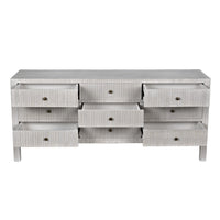 Light gray Conrad 9-drawer mahogany dresser with textured finish and brass knobs, several drawers open.