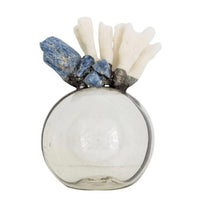Round glass bottle with white coral and blue kyanite, modern coastal style.