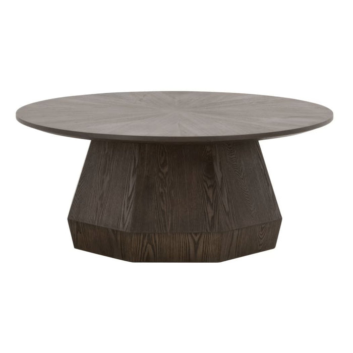 Coulter Burnished Brown Coffee Table with a round top and faceted pedestal base.