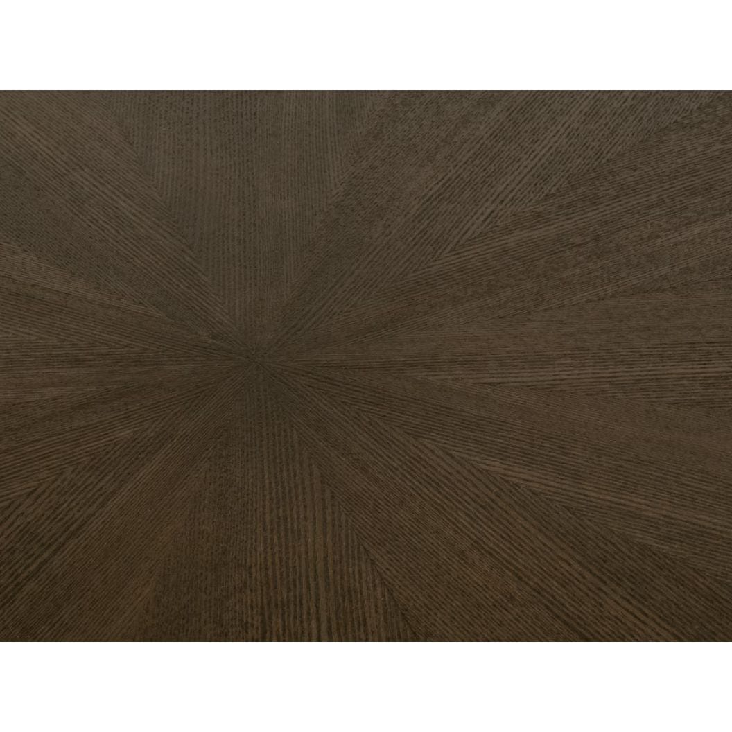 Coulter 54" burnished brown round dining table with a distinctive starburst wood grain pattern.