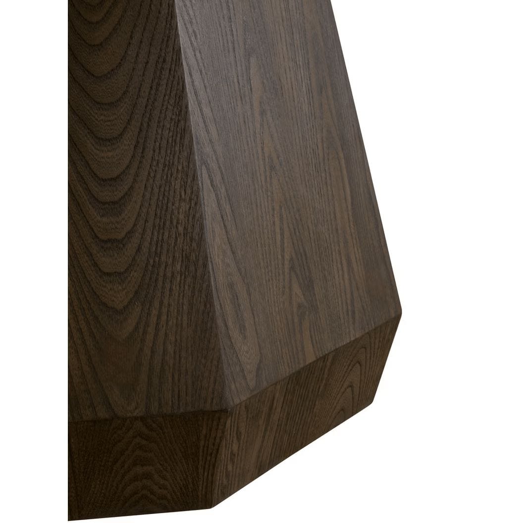 Close-up of Coulter Burnished Brown Round Dining Table's octagon pedestal base with wood grain.