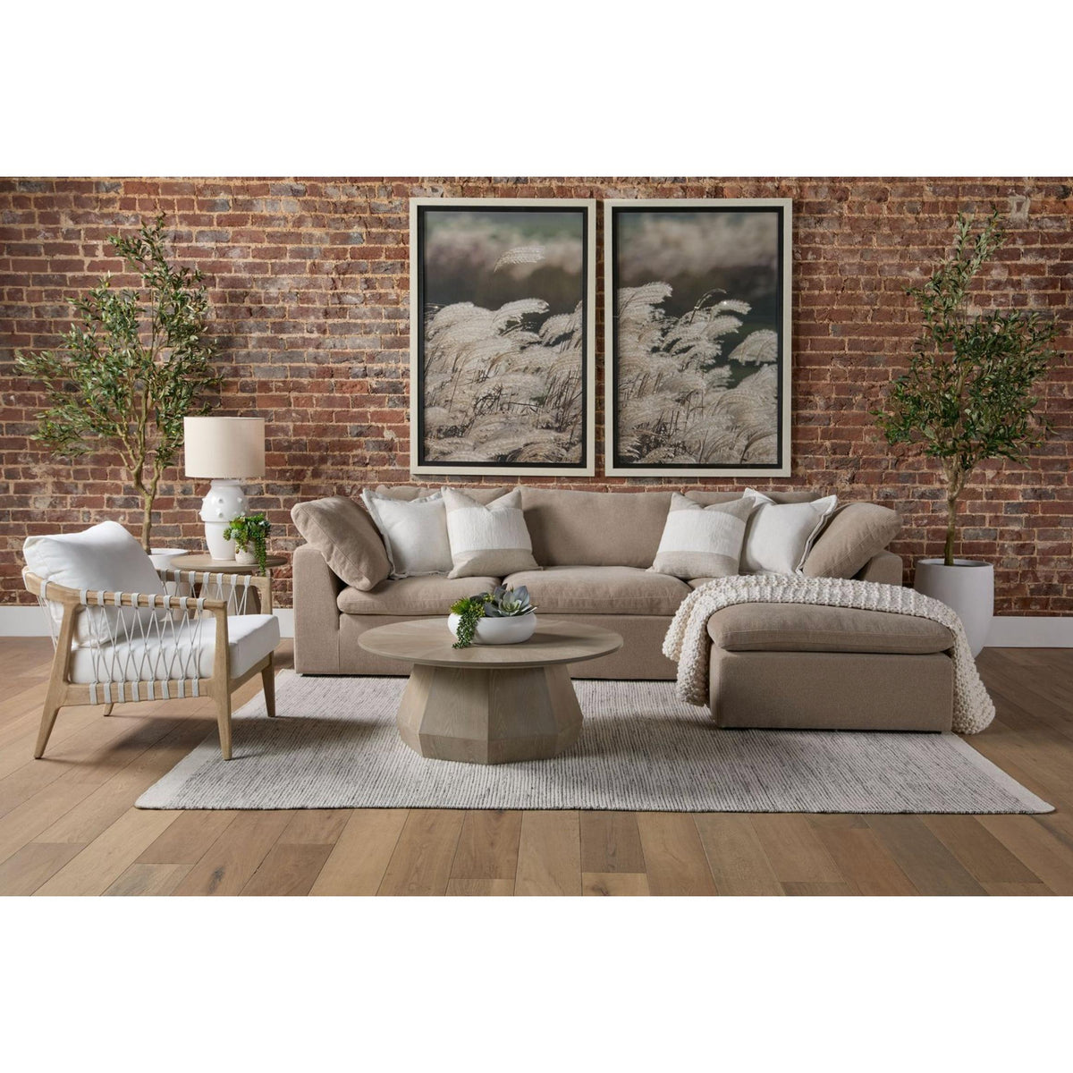 Coulter Natural Gray Ash Coffee Table with timeless design, round shape, and textured finish in a living room.