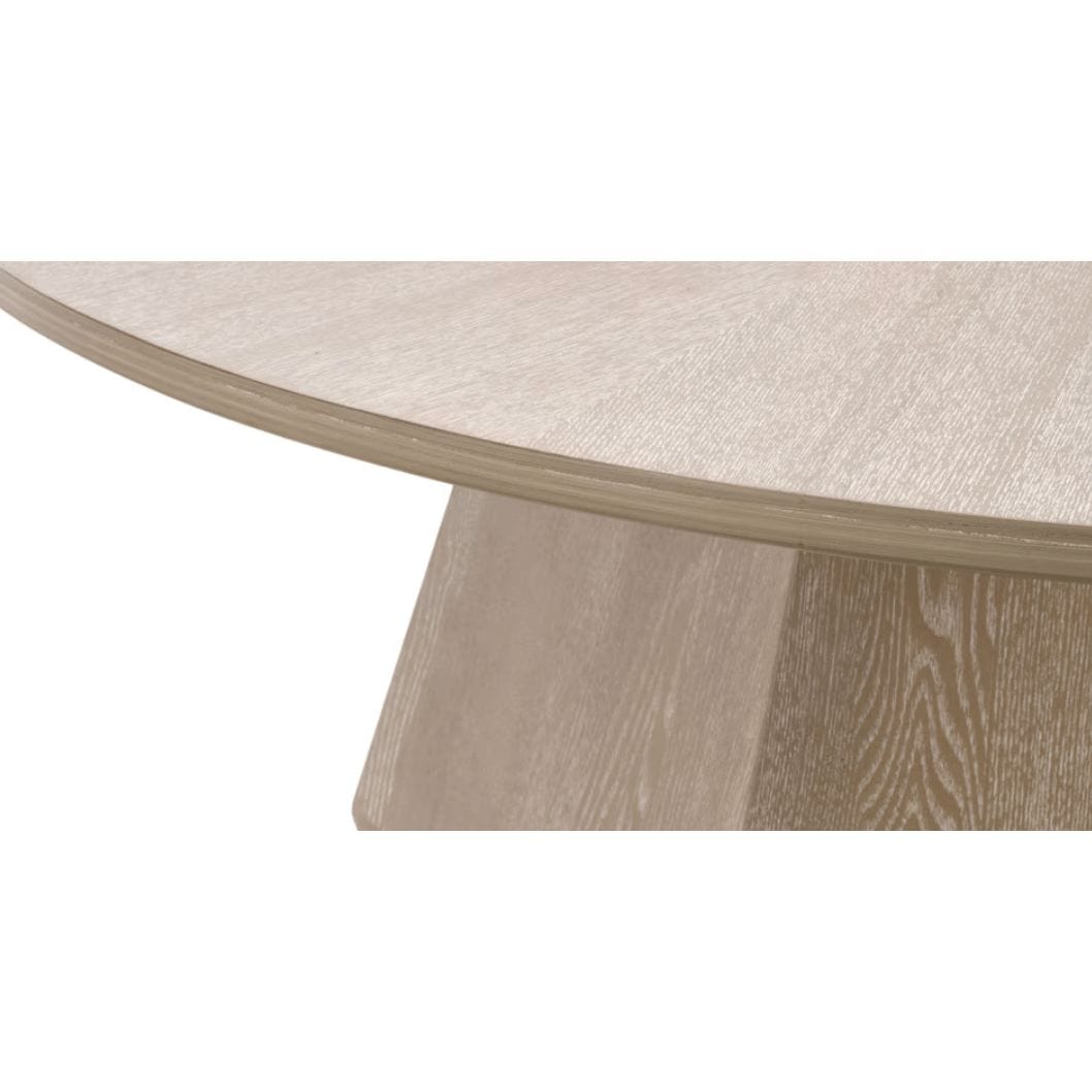 Coulter Natural Gray Ash Coffee Table with round top and modern pedestal base.