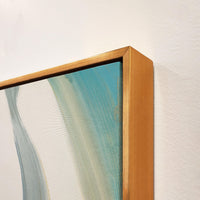 Abstract giclee canvas painting with hand-embellished gold and acrylic paint, framed in a gold floating frame.