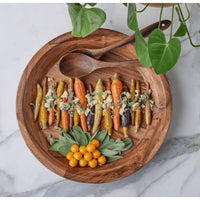 Acacia wood serving bowl, 15-inch wide, with roasted carrots, sage, and ground cherries.