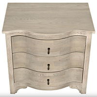 Vintage grey elm side table with curved front and three subtly curved drawers.