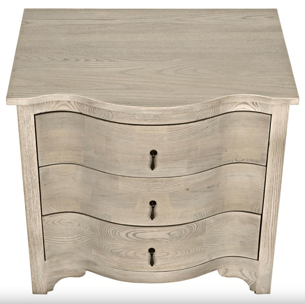 Vintage grey elm side table with curved front and three subtly curved drawers.