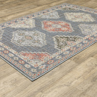 Cyprus Blue & Multi Outdoor Rug with traditional Persian and geometric patterns on a wood floor.