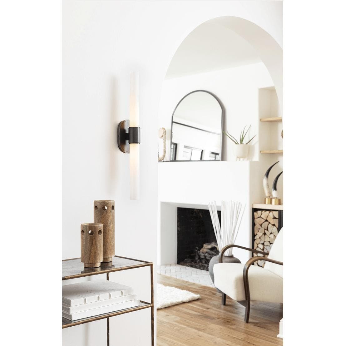 Daylon Horn Small: Matte natural horn sculpture on a brass base, 15" tall, in a chic living room.