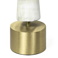 Daylon Horn Small sculpture: natural matte horn on a round brass base.