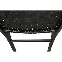 Dede Black Leather Dining Chair with handwoven leather seat and slim, tapered teak legs.