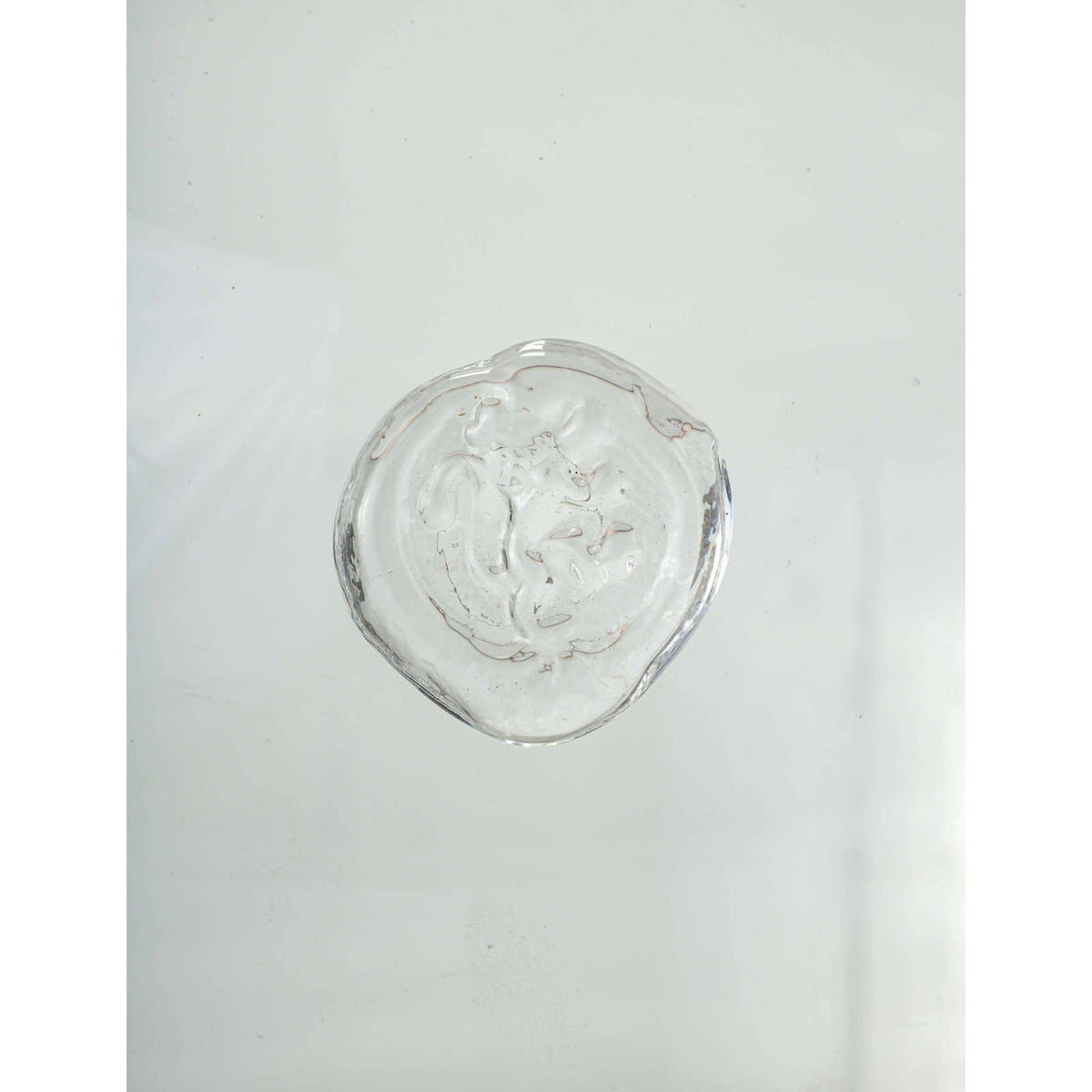 Clear glass medallion with a subtle copper stripe, a key detail for the Demi John Table Lamp.