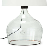 Large Demi John table lamp with a clear glass vessel base, copper stripe, and white linen shade.