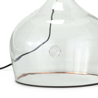 Large clear glass demi john lamp base with a copper stripe and black cloth cord.