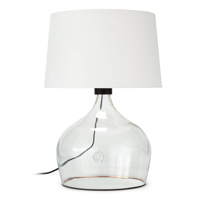 Large Demi John table lamp with clear glass vessel base, white linen shade, and copper stripe.