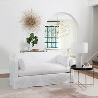 Black leather tray end table with a polished nickel frame next to a white sofa.