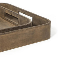 Set of two brown genuine leather rectangle trays with built-in handles and stitched edges.