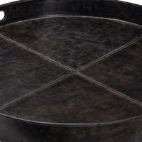 Dark brown genuine leather round tray with decorative cross-stitching and two cutout handles.