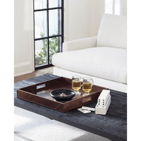 Black Derby Square Leather Tray with built-in handles, styled on a coffee table with drinks and games.