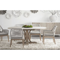 Devon 54" round natural gray acacia wood extension dining table with four woven chairs.
