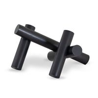 Dion Sculpture: Four elegant black metal cylinders arranged in an abstract, engaging design.