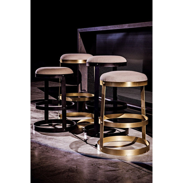 Dior Bar Stool with soft linen seat, black steel base, and antique brass accents.