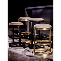Dior Bar Stool with antique brass finish, three circular metal bands, and a soft linen seat.
