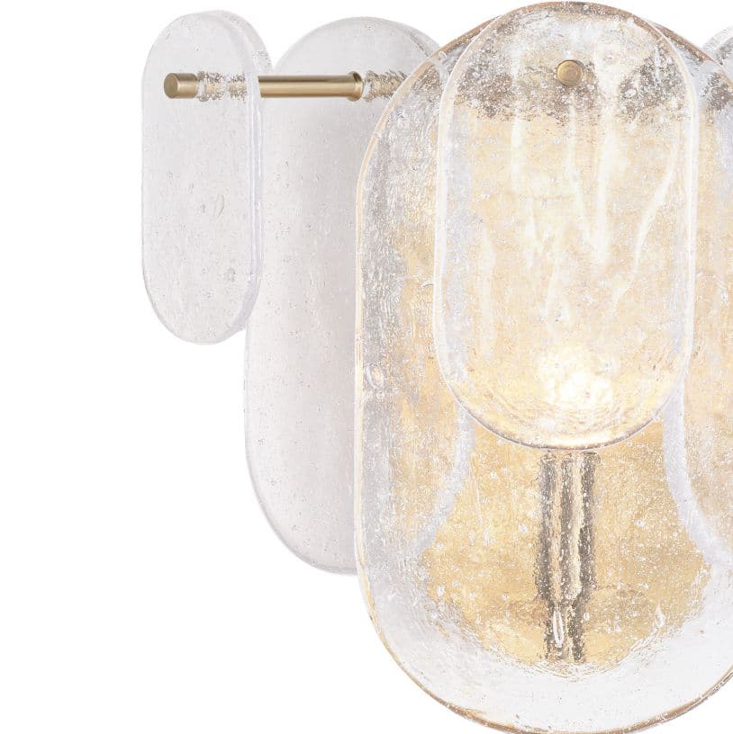 Modern Echo sconce with natural brass hardware and textured water glass panes, emitting a soft glow.
