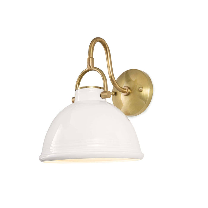 White ceramic Eloise sconce with a classic dome shade and natural brass accents.