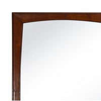 Estaban Leather Mirror with rounded glass in a rectangular brown leather-wrapped frame.
