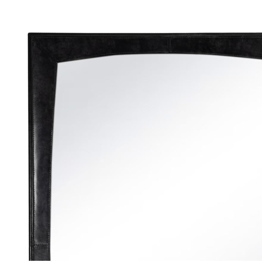 Estaban black leather mirror with rounded edges within a rectangular frame.