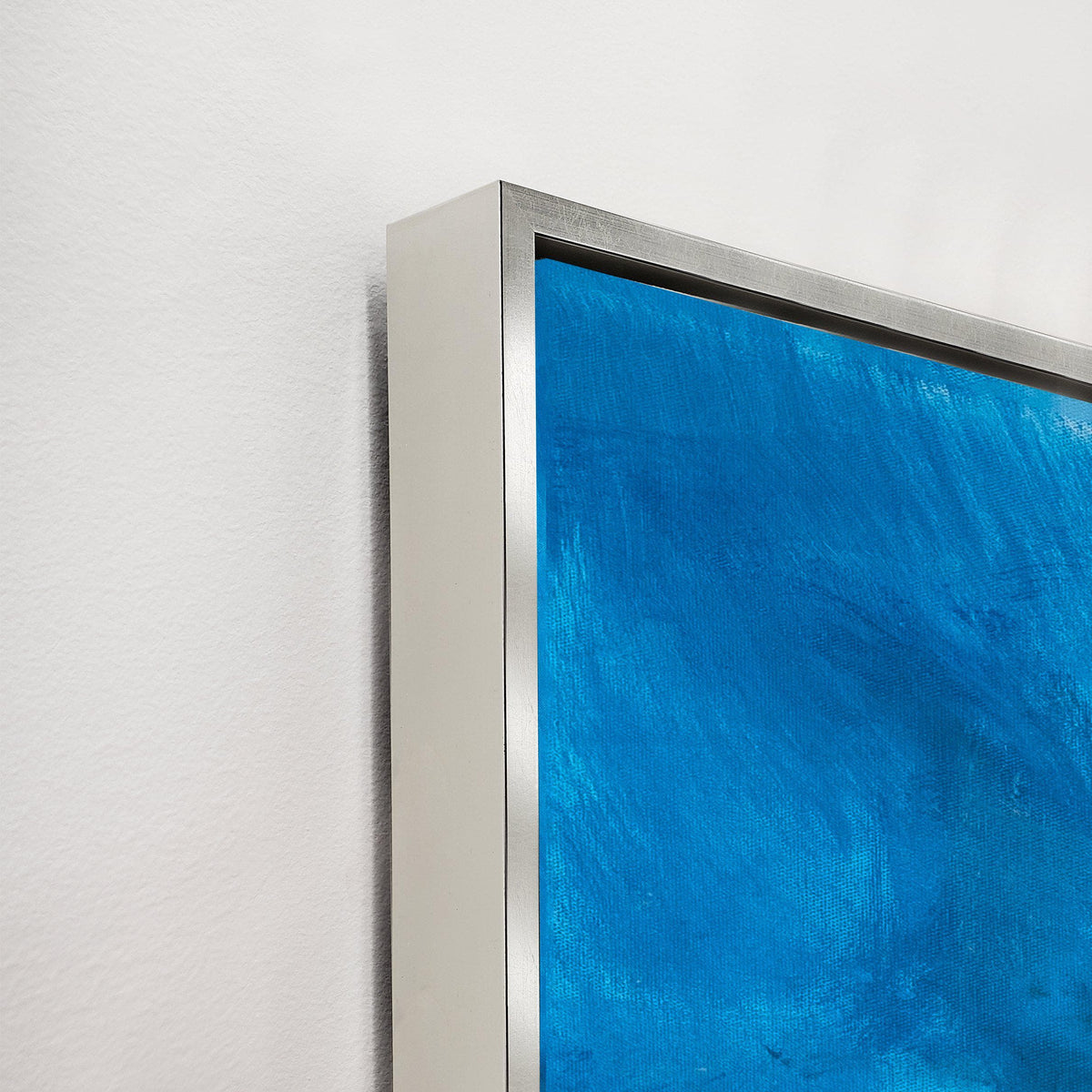 Ethereal Blue Giclee Canvas Painting, a close-up of the textured blue artwork with a sleek silver frame.