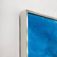 Ethereal Blue Giclee Canvas Painting, a close-up of the textured blue artwork with a sleek silver frame.