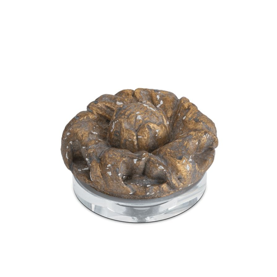 Evette distressed brass-look resin ornament on a clear crystal base.