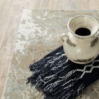 Evolution Beige & Grey Contemporary Rug with natural landscape design, textured yarns, and distressed vase.