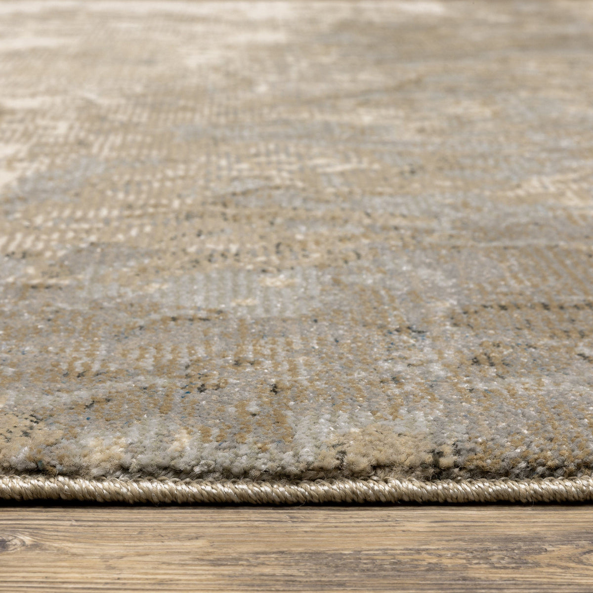 Evolution Beige & Grey Contemporary Rug with textured yarns and natural landscape design on wood floor.