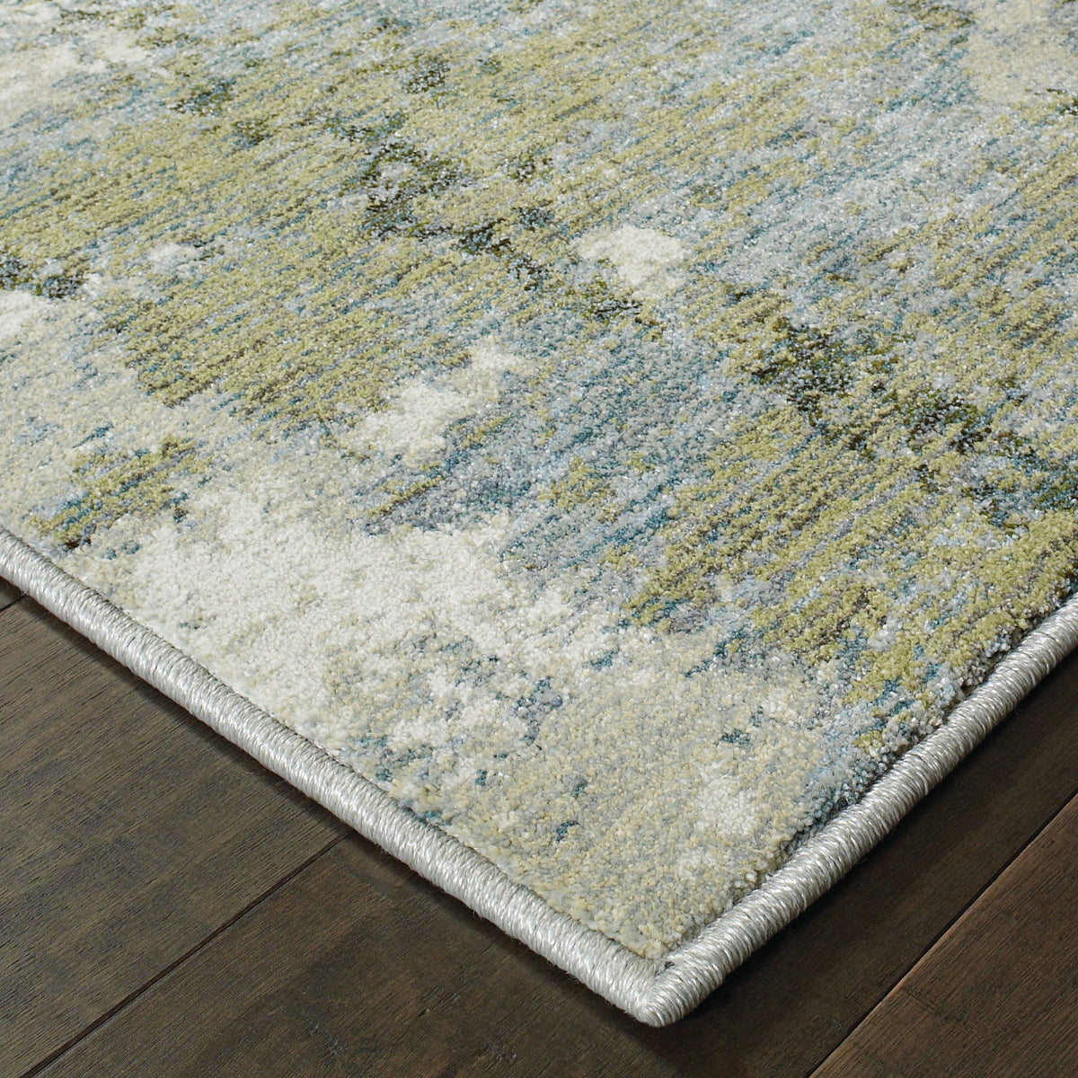 Evolution Blue & Green Contemporary Rug with abstract landscape design, textured nylon/polypropylene blend.