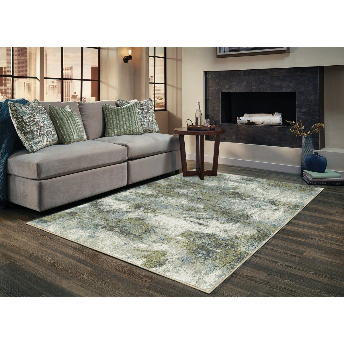 Evolution Blue & Green Contemporary Rug with abstract landscape design in a living room.