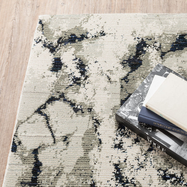 Evolution Contemporary Rug with ivory, charcoal, and black abstract design, featuring shiny and matte yarns.