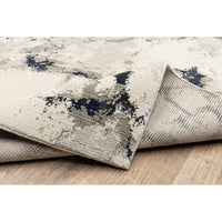 Evolution Contemporary Rug: Ivory, Charcoal & Black with abstract blue accents, power-loomed nylon/polypropylene blend.
