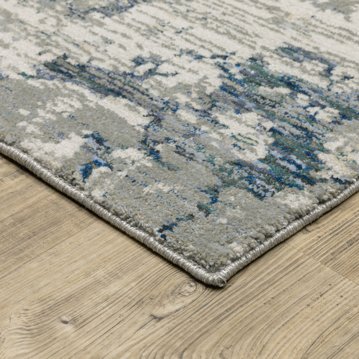 Evolution Grey & Blue Contemporary Rug with abstract design, textured nylon/polypropylene blend.