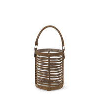 Small Finn Leather Hurricane lantern with woven brown leather base and clear glass insert.